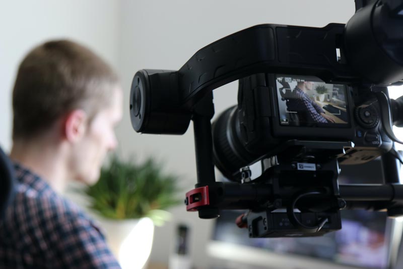 A video equipment with a blurred man on the background