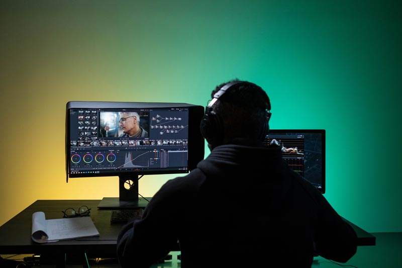 Man Editing a video on a Desktop
