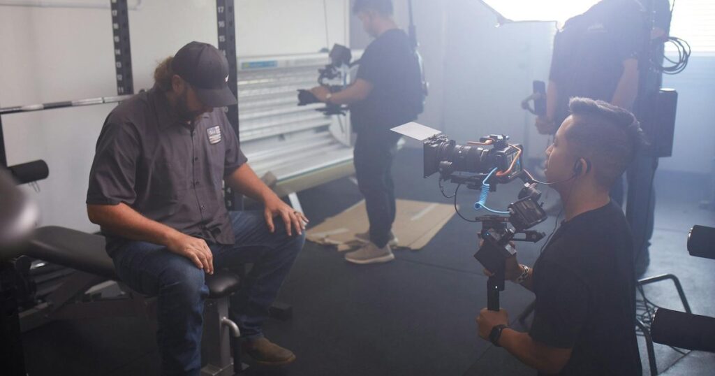 Professional video production team filming in a studio