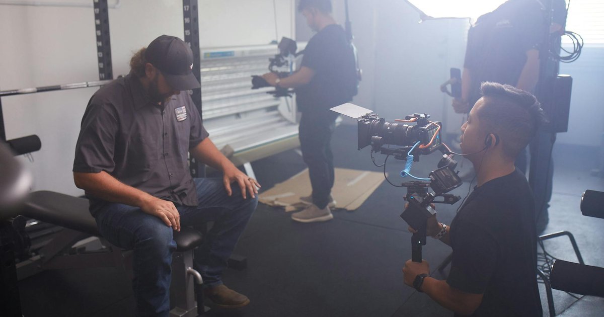 Professional video production team filming in a studio